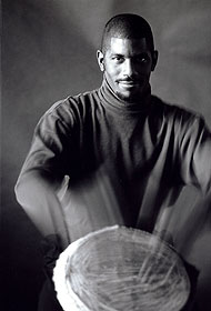 Douglas Cardwell plays the hand drum.